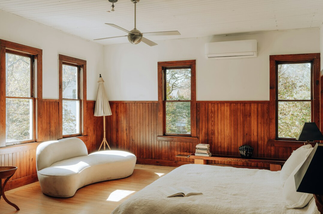 Serene bedroom with linen bedding and a reading nook