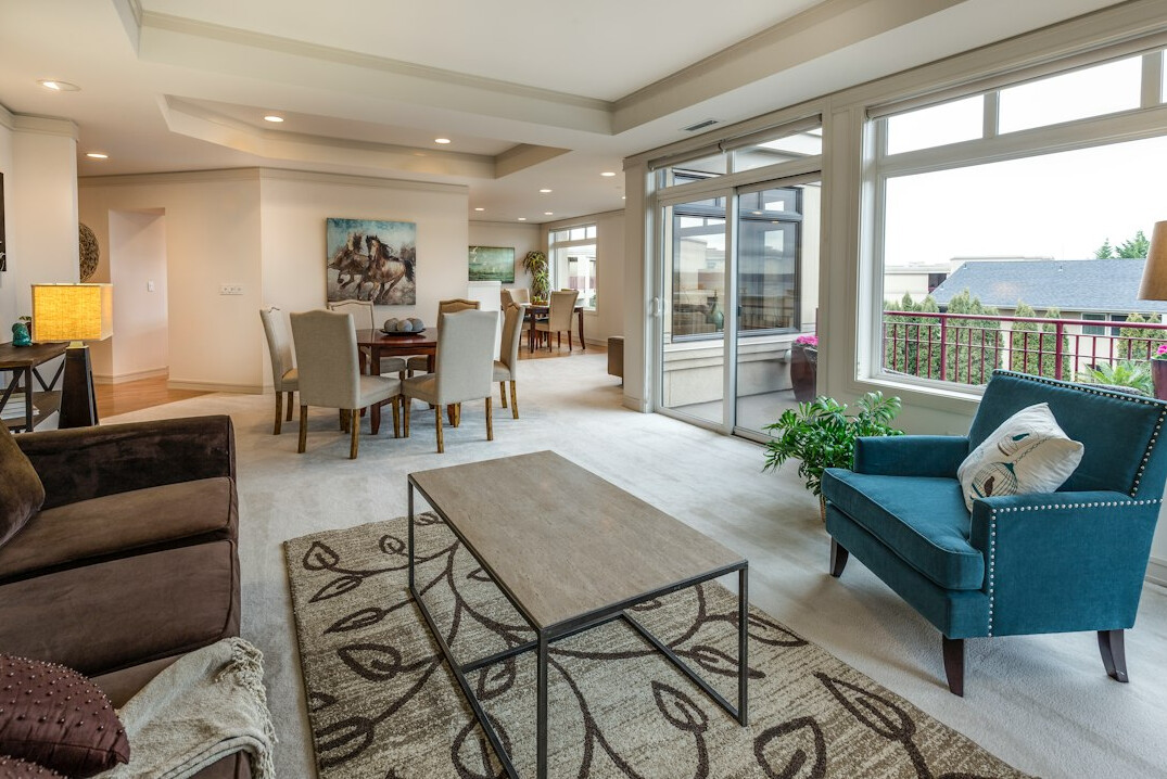 Bright living room with designer furniture and large windows