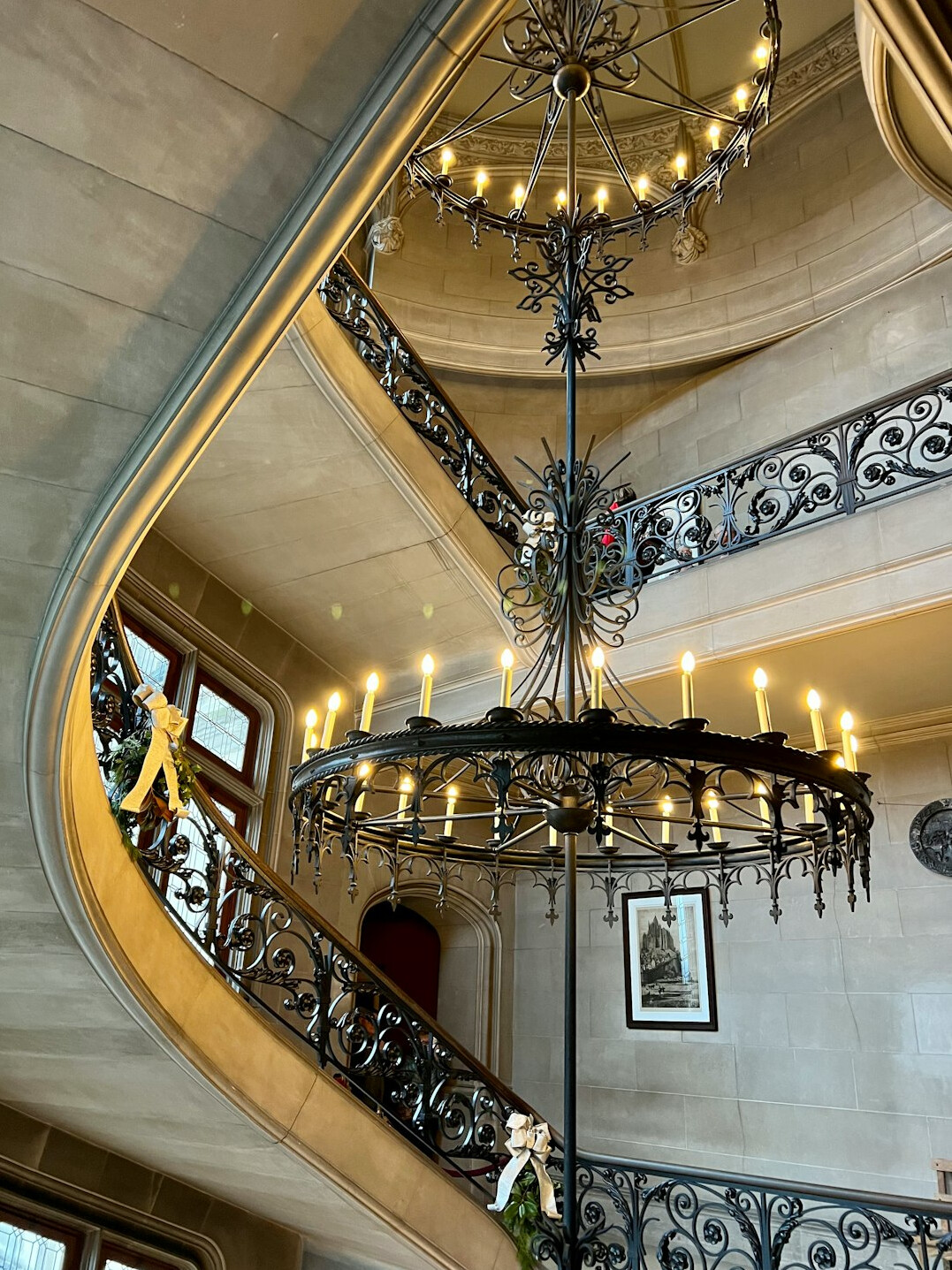 Curved staircase with wrought iron railing in a historic house