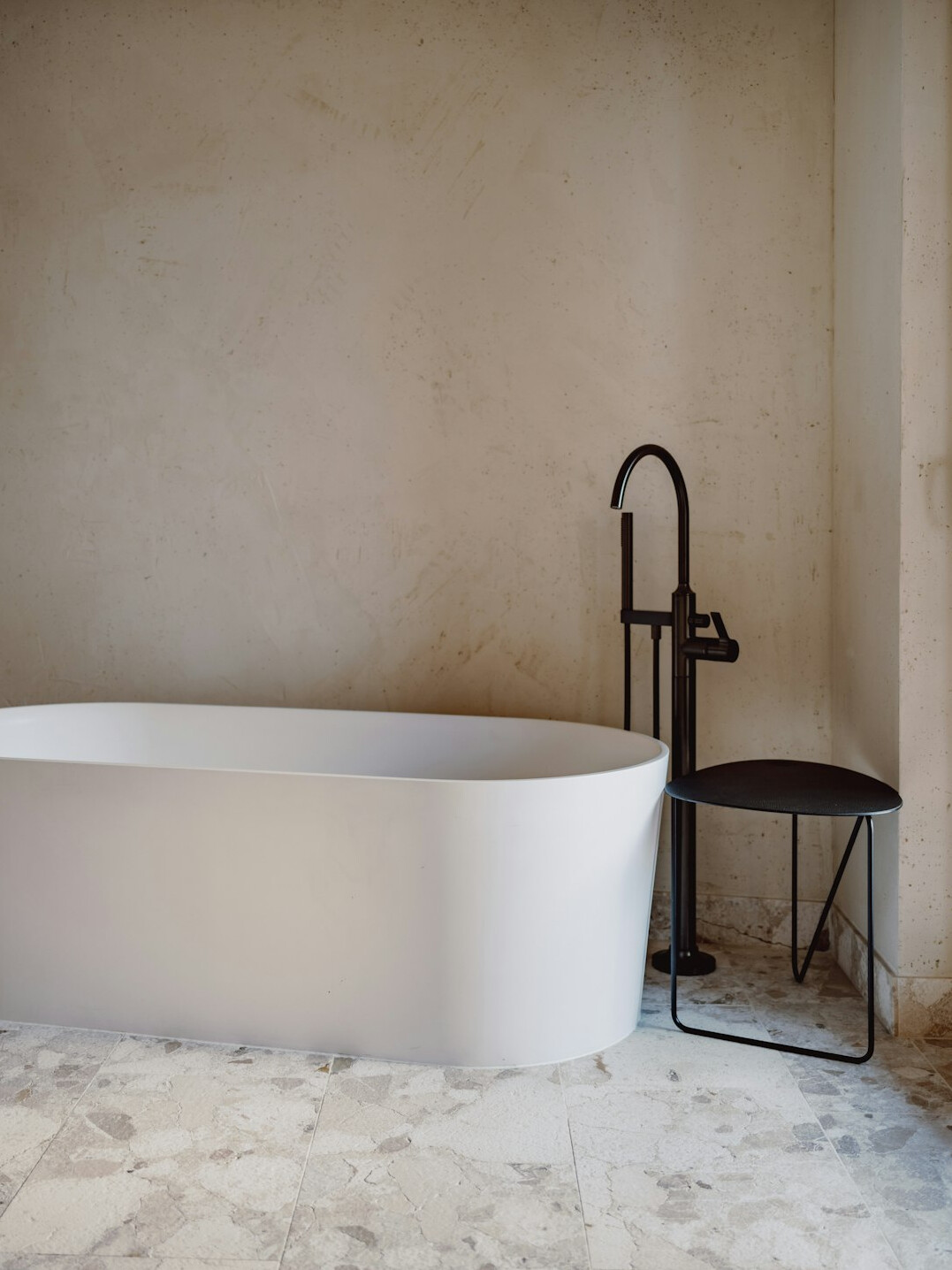 Spa-like bathroom with natural stone and a freestanding tub